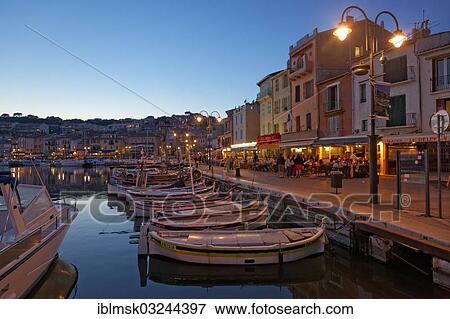 Stock Photo - "Harbour and historic town centre, small fishing boats, street cafes and restaurants, evening mood, Cassis, Departement Bouches-du-Rhone, Region Provence-Alpes-Cote dâ€™Azur dâ€™Azur, France, Europe". Fotosearch