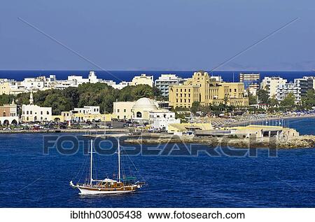 "Harbour entrance of Rhodes in front of the casino and other buildings, with a sailing ship in the foreground, Rhodes, Rhodos Island, Dodecanese, Greece, Europe" View Large Photo Image Stock Photo - "Harbour entrance of Rhodes in front of the casino and other buildings, with a sailing ship in the foreground, Rhodes, Rhodos Island, Dodecanese, Greece, Europe". Fotosearch