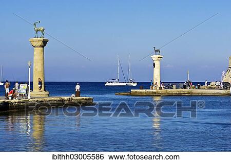 "Harbour entrance of Rhodes with Elafos and Elafina, sculptures of a deer buck and a doe on columns, Mandraki harbour, Rhodes, Rhodos Island, Dodecanese, Greece, Europe" View Large Photo Image Stock Photograph - "Harbour entrance of Rhodes with Elafos and Elafina, sculptures of a deer buck and a doe on columns, Mandraki harbour, Rhodes, Rhodos Island, Dodecanese, Greece, Europe". Fotosearch