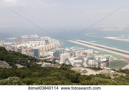"Harbour, marina, and runway of Gibraltar International Airport or North Front Airfield, San Felipe Pier in Spain and Bay of Gibraltar from Upper Rock Nature Reserve, Rock of Gibraltar, British Overseas Territory of Gibraltar" View Large Photo Image Picture - "Harbour, marina, and runway of Gibraltar International Airport or North Front Airfield, San Felipe Pier in Spain and Bay of Gibraltar from Upper Rock Nature Reserve, Rock of Gibraltar, British Overseas Territory of Gibraltar". Fotosearch