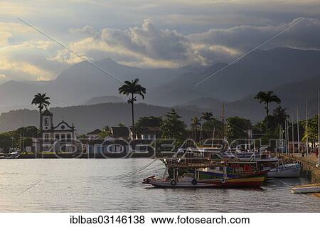 "Harbour with excursion boats in the evening light, church Capela de Santa Rita at back, Paraty, Rio de Janeiro State, Brazil, South America" View Large Photo Image Stock Photo - "Harbour with excursion boats in the evening light, church Capela de Santa Rita at back, Paraty, Rio de Janeiro State, Brazil, South America". Fotosearch