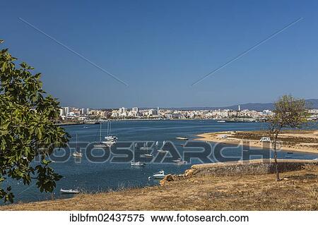 "Harbour with views of Portimao, fishing village of Ferragudo, Algarve, Portugal, Europe" View Large Photo Image Stock Photography - "Harbour with views of Portimao, fishing village of Ferragudo, Algarve, Portugal, Europe". Fotosearch