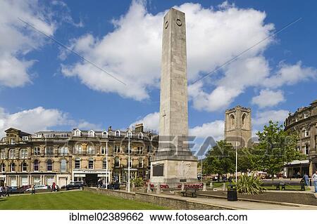 Stock Image - "Harrogate's Cenotaph or War Memorial and St Peter's Church, Cambridge Crescent, Harrogate, North Yorkshire, England, United Kingdom, Europe". Fotosearch