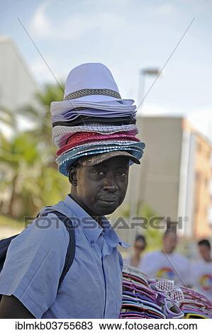 "Hat seller with a stack of hats on his head, Bunol, Province of Valencia, Spain, Europe" View Large Photo Image Stock Image - "Hat seller with a stack of hats on his head, Bunol, Province of Valencia, Spain, Europe". Fotosearch