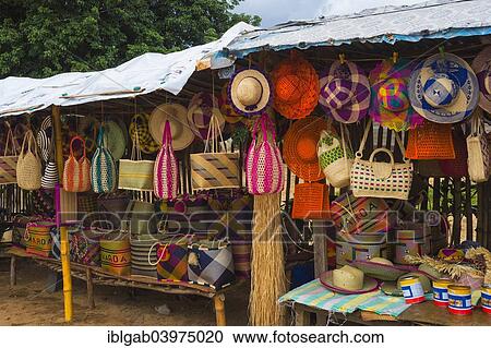 Stock Image - "Hats and baskets in a market stall, Maroantsetra, Madagascar, Africa". Fotosearch