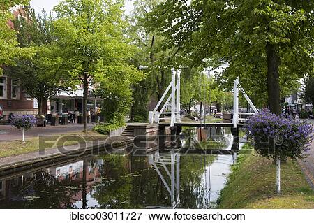 Stock Photo - "Hauptkanal canal with bridge, Emsland, Papenburg, Lower Saxony, Germany, Europe". Fotosearch