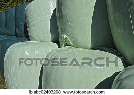 Stock Photo - "Hay bales wrapped in green plastic sheeting, Schaeftlarn, Bavaria, Germany, Europe". Fotosearch