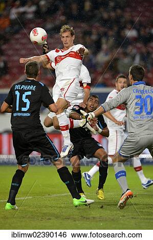 Stock Photograph - "Head duel, Georg Niedermeier, VfB Stuttgart, against Matthieu DELPIERRE, TSG 1899 Hoffenheim, and goalkeeper Koen CASTEELS, TSG 1899 Hoffenheim, Mercedes-Benz Arena, Stuttgart, Baden-Wuerttemberg, Germany, Europe". Fotosearch