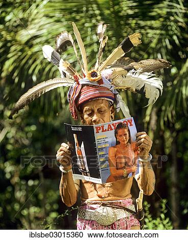 "Head hinters of the ethnic group of the Iban people reading a Playboy magazine, Skrang River, Rajang, Sarawak, Malaysia, Borneo, Asia" View Large Photo Image Stock Image - "Head hinters of the ethnic group of the Iban people reading a Playboy magazine, Skrang River, Rajang, Sarawak, Malaysia, Borneo, Asia". Fotosearch