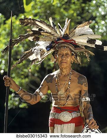 "Head hunter of the ethnic group of the Iban people with a spear, Skrang River, Rajang, Sarawak, Borneo, Malaysia, Asia" View Large Photo Image Stock Image - "Head hunter of the ethnic group of the Iban people with a spear, Skrang River, Rajang, Sarawak, Borneo, Malaysia, Asia". Fotosearch