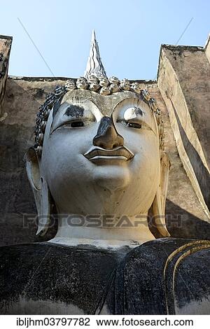 "Head of the Buddha statue Phra Achana, Wat Si Chum or Wat Sri Chum, Sukhothai Historical Park, Sukhothai, Northern Thailand, Thailand, Asia" View Large Photo Image Stock Image - "Head of the Buddha statue Phra Achana, Wat Si Chum or Wat Sri Chum, Sukhothai Historical Park, Sukhothai, Northern Thailand, Thailand, Asia". Fotosearch