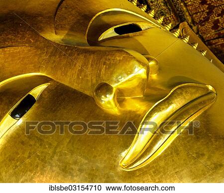 Stock Image - "Head, Reclining Buddha, 45m long, 15m high, Wat Pho Temple, Bangkok, Central Thailand, Thailand, Asia". Fotosearch