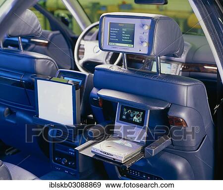 "Headrest in a BMW with a built-in monitor with internet access, a console with a DVD player and a monitor" View Large Photo Image Stock Photo - "Headrest in a BMW with a built-in monitor with internet access, a console with a DVD player and a monitor". Fotosearch