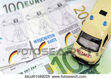 "Health insurance cards and miniature ambulance, symbolic image for financial difficulties of health insurances" View Large Photo Image Stock Photo - "Health insurance cards and miniature ambulance, symbolic image for financial difficulties of health insurances". Fotosearch