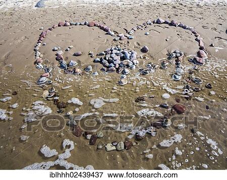 "Heart made from stones on a beach, Usedom Island, Mecklenburg-Western Pomerania, Germany, Europe" View Large Photo Image Stock Photo - "Heart made from stones on a beach, Usedom Island, Mecklenburg-Western Pomerania, Germany, Europe". Fotosearch