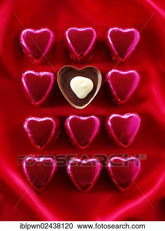 Stock Image - Heart-shaped chocolates. Fotosearch