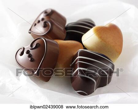 Heart-shaped chocolates View Large Photo Image Stock Photo - Heart-shaped chocolates. Fotosearch