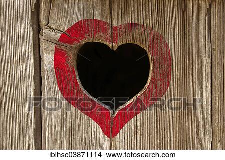 Heart-shaped hole of a toilet house View Large Photo Image Picture - Heart-shaped hole of a toilet house. Fotosearch