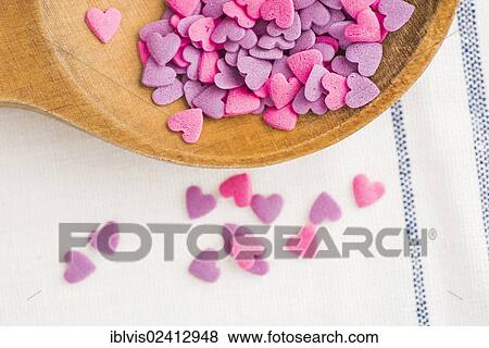 Heart-shaped pink and purple sprinkles View Large Photo Image Stock Photo - Heart-shaped pink and purple sprinkles. Fotosearch
