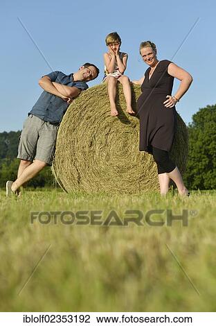 "Heavily pregnant women, nine months, young man and girl, six years, standing on a straw bale, Germany, Europe" View Large Photo Image Stock Image - "Heavily pregnant women, nine months, young man and girl, six years, standing on a straw bale, Germany, Europe". Fotosearch