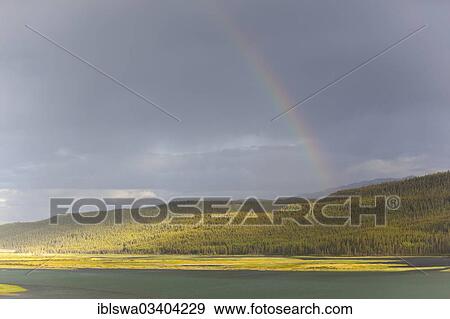 "Heavy clouds and rainbow over Marsh Lake, headwaters of the Yukon River, near Whitehorse, Yukon Territory, Canada, North America" View Large Photo Image Stock Photo - "Heavy clouds and rainbow over Marsh Lake, headwaters of the Yukon River, near Whitehorse, Yukon Territory, Canada, North America". Fotosearch