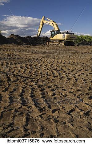 "Heavy tire tracks and excavator in a commercial sandpit, Quebec City, Quebec Province, Canada, North America" View Large Photo Image Stock Photograph - "Heavy tire tracks and excavator in a commercial sandpit, Quebec City, Quebec Province, Canada, North America". Fotosearch