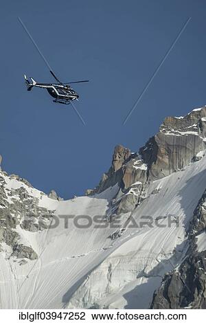 "Helicopter of the Gendarmerie in flight, in front of the Mont Blanc massif, Chamonix-Mont-Blanc, Haute Savoie, Rhone-Alpes, France, Europe" View Large Photo Image Stock Image - "Helicopter of the Gendarmerie in flight, in front of the Mont Blanc massif, Chamonix-Mont-Blanc, Haute Savoie, Rhone-Alpes, France, Europe". Fotosearch