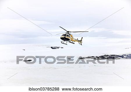 Stock Photo - "Helicopter over Devil Island, Weddell Sea, Antarctica". Fotosearch