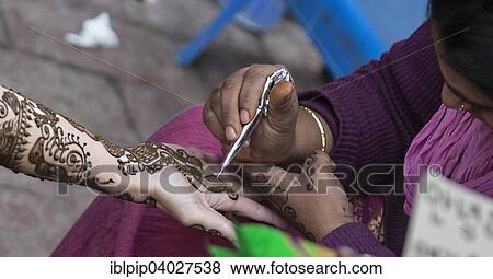 "Henna tattoo artist on the Chandni Chowk market, Delhi, India, Asia" View Large Photo Image Stock Photo - "Henna tattoo artist on the Chandni Chowk market, Delhi, India, Asia". Fotosearch