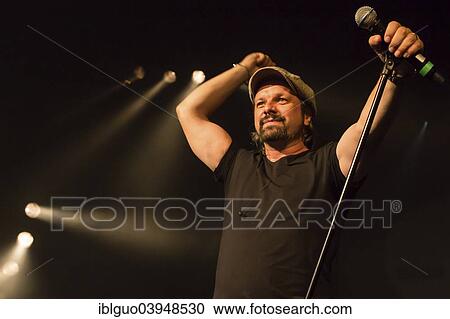 "Henning Wehland, singer of the German band """"Sohne Mannheim"""", performing live at the Blue Balls Festival, Lucerne, Switzerland, Europe" View Large Photo Image Stock Image - "Henning Wehland, singer of the German band """"Sohne Mannheim"""", performing live at the Blue Balls Festival, Lucerne, Switzerland, Europe". Fotosearch