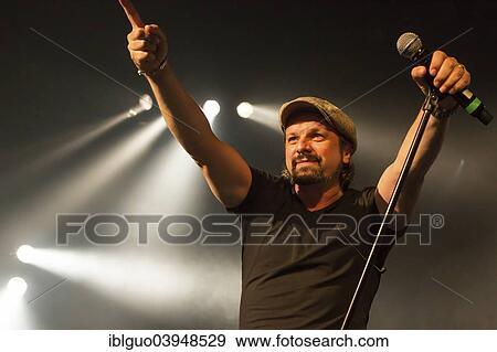 "Henning Wehland, singer of the German band """"Sohne Mannheims"""", performing live at the Blue Balls Festival, Lucerne, Switzerland, Europe" View Large Photo Image Stock Photo - "Henning Wehland, singer of the German band """"Sohne Mannheims"""", performing live at the Blue Balls Festival, Lucerne, Switzerland, Europe". Fotosearch
