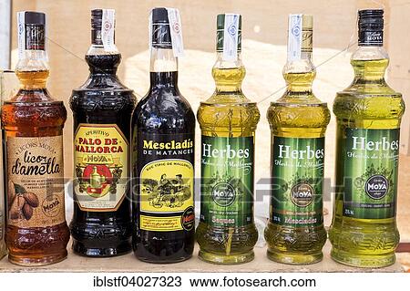 Stock Image - "Herbal liqueur, almond liqueur, liqueurs, weekly market market of Porto Colom, Majorca, Balearic Islands, Spain, Europe". Fotosearch