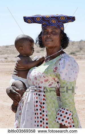 "Herero woman with baby, Namibia, Africa" View Large Photo Image Stock Photo - "Herero woman with baby, Namibia, Africa". Fotosearch