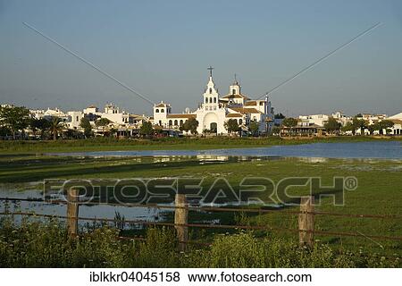 "Hermitage of El Rocio in the lagoon of the Donana National Park, El Rocio, Costa de la Luz, Andalusia, Spain, Europe" View Large Photo Image Stock Photo - "Hermitage of El Rocio in the lagoon of the Donana National Park, El Rocio, Costa de la Luz, Andalusia, Spain, Europe". Fotosearch