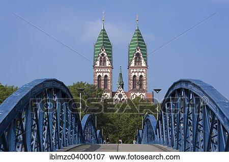 "Herz Jesu-Kirche, or Sacred Heart Church, built in the style of Historicism, consecrated in 1897, the Wiwilibrucke, or Blue Bridge, at front, Freiburg, Baden-Wurttemberg, Germany, Europe" View Large Photo Image Stock Photo - "Herz Jesu-Kirche, or Sacred Heart Church, built in the style of Historicism, consecrated in 1897, the Wiwilibrucke, or Blue Bridge, at front, Freiburg, Baden-Wurttemberg, Germany, Europe". Fotosearch