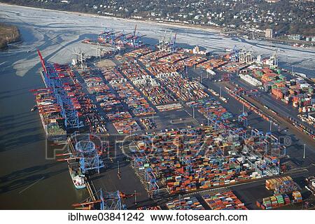 "HHLA Container Terminal Burchardkai in winter with ice on the Elbe, Hamburg, Germany, Europe" View Large Photo Image Stock Image - "HHLA Container Terminal Burchardkai in winter with ice on the Elbe, Hamburg, Germany, Europe". Fotosearch