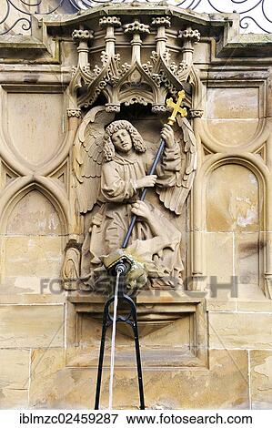 Stock Photo - "High-relief of St. Michael and the Dragon as a well figure on the Gothic Fischbrunnen fountain, built in 1509 by the Haller sculptor Hans Beuscher, Marktplatz square, Schwaebisch Hall, Baden-Wuerttemberg, Germany, Europe, PublicGround, Europe". Fotosearch
