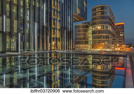 Stock Photograph - "High-rise buildings in the Media Harbour at night, Dusseldorf, Rhineland, North Rhine-Westphalia, Germany, Europe". Fotosearch
