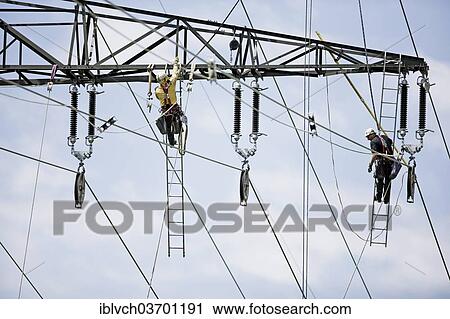 "High-voltage service technicians installing a new high voltage power line, Wiesing, Schwaz District, North Tirol, Tirol, Austria, Europe" View Large Photo Image Stock Image - "High-voltage service technicians installing a new high voltage power line, Wiesing, Schwaz District, North Tirol, Tirol, Austria, Europe". Fotosearch