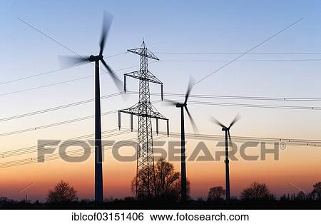 "High voltage transmission tower and wind turbines at dusk, Hamburg, Hamburg, Germany, Europe" View Large Photo Image Stock Photograph - "High voltage transmission tower and wind turbines at dusk, Hamburg, Hamburg, Germany, Europe". Fotosearch