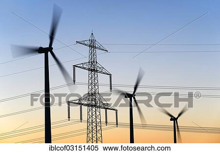 "High voltage transmission tower and wind turbines at dusk, Hamburg, Hamburg, Germany, Europe" View Large Photo Image Stock Photography - "High voltage transmission tower and wind turbines at dusk, Hamburg, Hamburg, Germany, Europe". Fotosearch