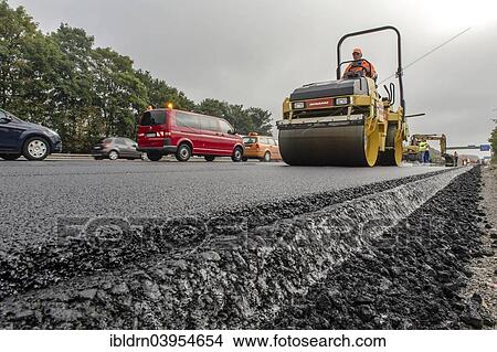 "Highway construction site, so-called silent tarmac is applied, Unna, North Rhine-Westphalia, Germany, Europe" View Large Photo Image Picture - "Highway construction site, so-called silent tarmac is applied, Unna, North Rhine-Westphalia, Germany, Europe". Fotosearch