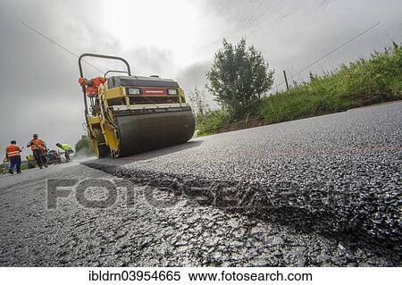"Highway construction site, so-called silent tarmac is applied, Unna, North Rhine-Westphalia, Germany, Europe" View Large Photo Image Stock Photography - "Highway construction site, so-called silent tarmac is applied, Unna, North Rhine-Westphalia, Germany, Europe". Fotosearch