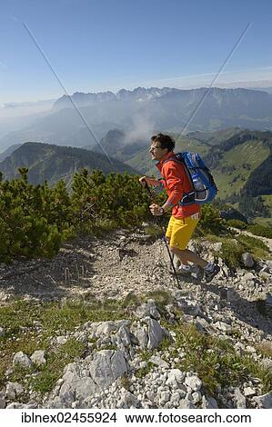 "Hiker ascending Geigelstein Mountain, Chiemgau, Bavaria, Germany, Europe" View Large Photo Image Picture - "Hiker ascending Geigelstein Mountain, Chiemgau, Bavaria, Germany, Europe". Fotosearch