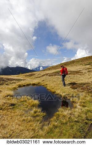 "Hiker at Glittner Lake on Col da Le, bei Welschellen, Gadertal, South Tyrol province, Trentino-Alto Adige, Italy, Europe" View Large Photo Image Stock Image - "Hiker at Glittner Lake on Col da Le, bei Welschellen, Gadertal, South Tyrol province, Trentino-Alto Adige, Italy, Europe". Fotosearch