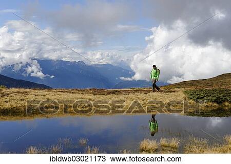 "Hiker at Glittner Lake on Col da Le, bei Welschellen, Gadertal, South Tyrol province, Trentino-Alto Adige, Italy, Europe" View Large Photo Image Stock Image - "Hiker at Glittner Lake on Col da Le, bei Welschellen, Gadertal, South Tyrol province, Trentino-Alto Adige, Italy, Europe". Fotosearch