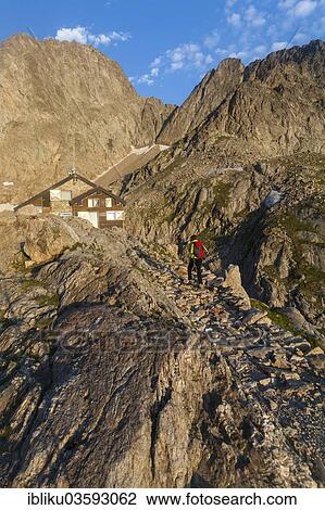 "Hiker at Rifugio Pagari mountain hut, Parco naturale delle Alpi Marittime nature reserve, bei Entracque, Cuneo province, Piedmont, Italy, Europe" View Large Photo Image Stock Image - "Hiker at Rifugio Pagari mountain hut, Parco naturale delle Alpi Marittime nature reserve, bei Entracque, Cuneo province, Piedmont, Italy, Europe". Fotosearch