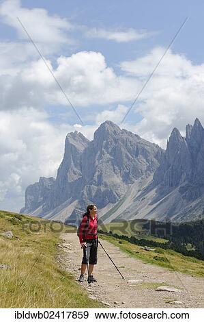 Hiker at the Raschotz or Rasciesa mountain pasture with the Odle group, Val Gardena valley, Southern Tyrol, Alto Adige, Italy, Europe View Large Photo Image Stock Photo - Hiker at the Raschotz or Rasciesa mountain pasture with the Odle group, Val Gardena valley, Southern Tyrol, Alto Adige, Italy, Europe. Fotosearch
