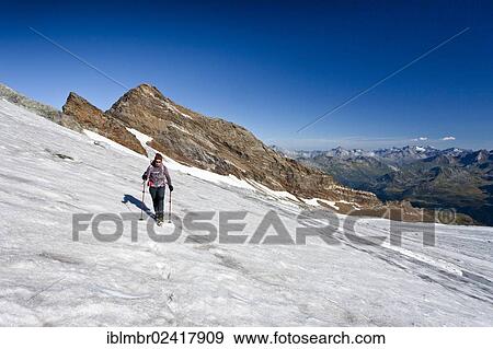 Hiker climbing Magerstein mountain, Puster valley, Schneebiger Nock mountain at the back, province of Bolzano-Bozen, Italy, Europe View Large Photo Image Stock Photo - Hiker climbing Magerstein mountain, Puster valley, Schneebiger Nock mountain at the back, province of Bolzano-Bozen, Italy, Europe. Fotosearch
