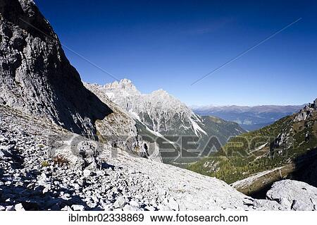"Hiker during the ascent to Alpinisteig Mountain through the Fischlein Valley above the Talschlusshuette hut, with Dreischusterspitze Mountain at the rear, Dolomites, Alta Pusteria, Sexten, Alto Adige, Italy, Europe" View Large Photo Image Stock Photo - "Hiker during the ascent to Alpinisteig Mountain through the Fischlein Valley above the Talschlusshuette hut, with Dreischusterspitze Mountain at the rear, Dolomites, Alta Pusteria, Sexten, Alto Adige, Italy, Europe". Fotosearch